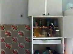 Russian girl masturbates, squirts and pees in the kitchen