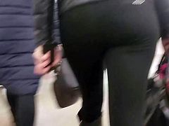 Hot woman with round ass in black pants