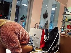 Candid voyeur in shoe store babe trying on shoes