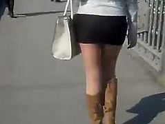 Girl in short skirt in the street