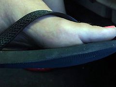 Ultra Close-Up of Women's Feet in Flip Flops