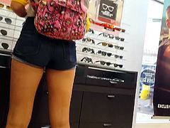 Candid voyeur gorgeous legs and ass in sunglass store