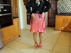 Black blouse and pink pleated skirt