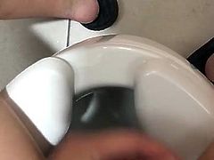 little dick boy cumming in a public toilet