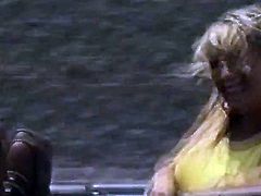 Blonde chick flashes tits in convertible car public road