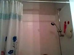 slim blonde records herself in the shower