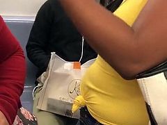 Braless Spanish woman in yellow shirt on the train 2