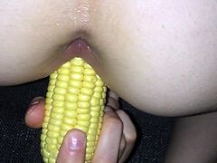 Friend fucking herself with a corn on the cob