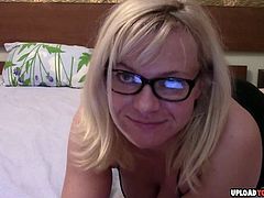 Mature with glasses plays with her cunt