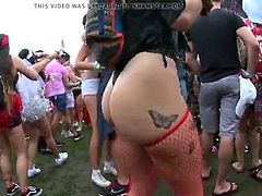 very sexy girl with a great naked butt dancing  in public