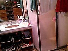 Sexy blond strips and takes a shower