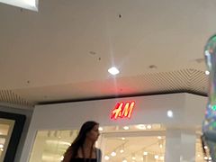 Candid voyeur long leg teen shopping in tiny shorts