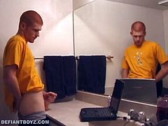 While watching some porn on his laptop. After a nice long stroking, he opens that release valve and fires all over the mirror and counter top. Tristian then picks up the camera so we can get a close-up look at the splattered cum on the mirror, as it runs down the glass.
