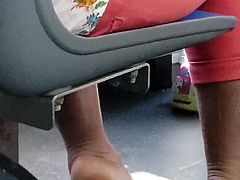 Candid ebony showing heel of her feet