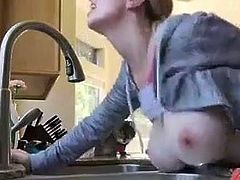 Bent over the kitchen sink