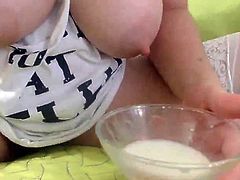 Very cute brunette milking her lovely tits
