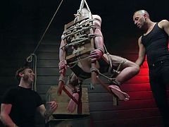 This incredible sight definitely deserves your attention! Three men, one of them, William Crown, is naked and tied to a chair, and this chair hangs on ropes in the middle of the room, high above the floor. William is not able to oppose them, while one of them sucks his toes and the other is sucking his dick...