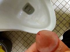 Blasting a huge load over a urinal