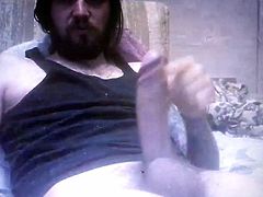 Bearded longhaired guy edging his thick huge hung cock