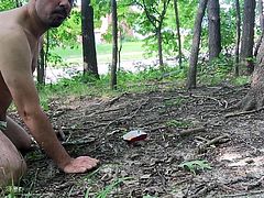 pup naked near the road eating like a dog