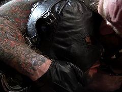 black leather mask and tight rope bondage