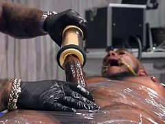 Ah, this is a beautiful sight for those who appreciate refined bdsm punishments! Micah's big black cock draws so much attention that his tormentor, Jason Collins, decides to start with it, using a special kinky device. Join to enjoy hot interracial gay bondage!