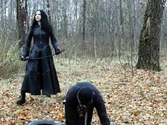 Check out this smoking hot and horny brunette dominant woman walking on a leash her male slave in the forest.Watch this fetish video in HD.