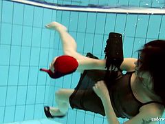Kristy in a see through dress underwater