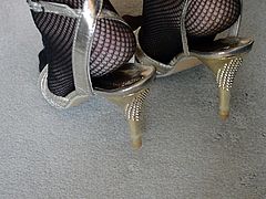Feet in RT Fishnet Pantyhose & High Heels Close Up