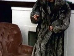 Check out this smoking hot and horny mature woman wearing a fur coat and dominating her male slave.Watch him licking her leather boots in HD.