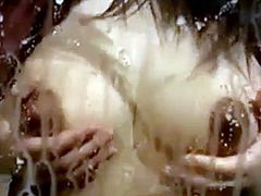 Asian girl massages her swolen tits and a stream of mothermilk starts to flow