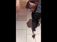 Pissing her pants while walking in public