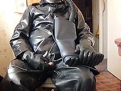 Rubber and oilskin cock play