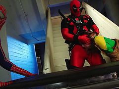 This group of cosplayers decide to rent a place together for the night and sleep there, but looks like spiderman has other intentions, as he brings the petite babe to the stairs, and proceeds to pound her pussy there, before Deadpool finds out and joins in by stuffing his hard cock down her throat