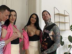 These two horny tattooed studs went to a bar to pick up some gals and when they met these two kinky big titty hotties, they brought them back to their apartment to get sloppy blowies from them before dicking them down from behind in doggy.