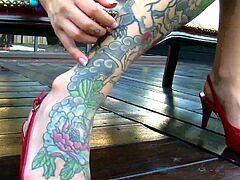 Emma Mae is beading her cunt in this outdoor scene