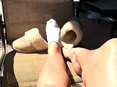 Brunette with foot fetish rubs big dick with her feet in POV